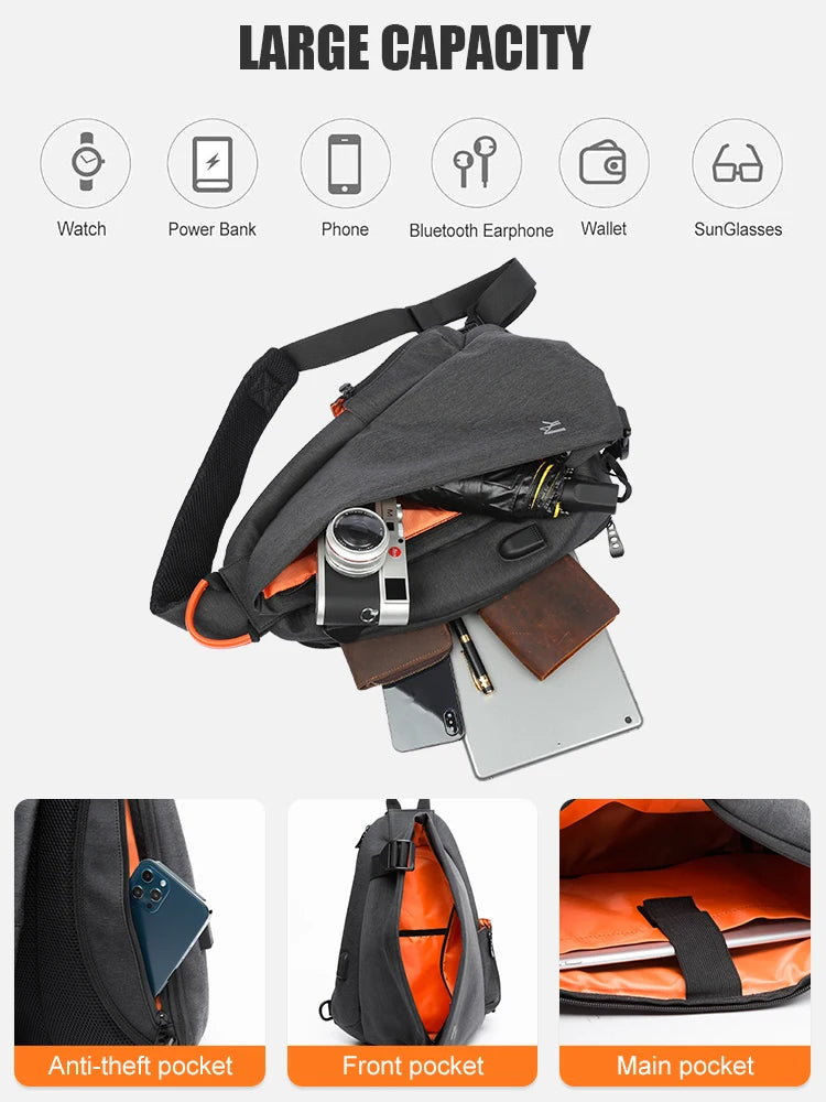 Black crossbody bag with various compartments and items on a white background