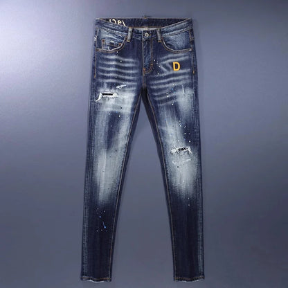 Distressed blue jeans with a brand logo on a gray background