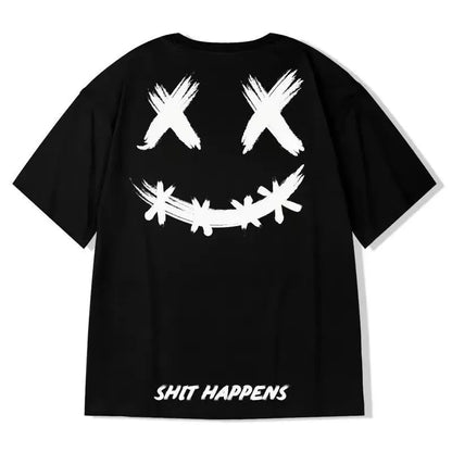 Black t-shirt with white smiley face and 'SHIT HAPPENS' text on a white background
