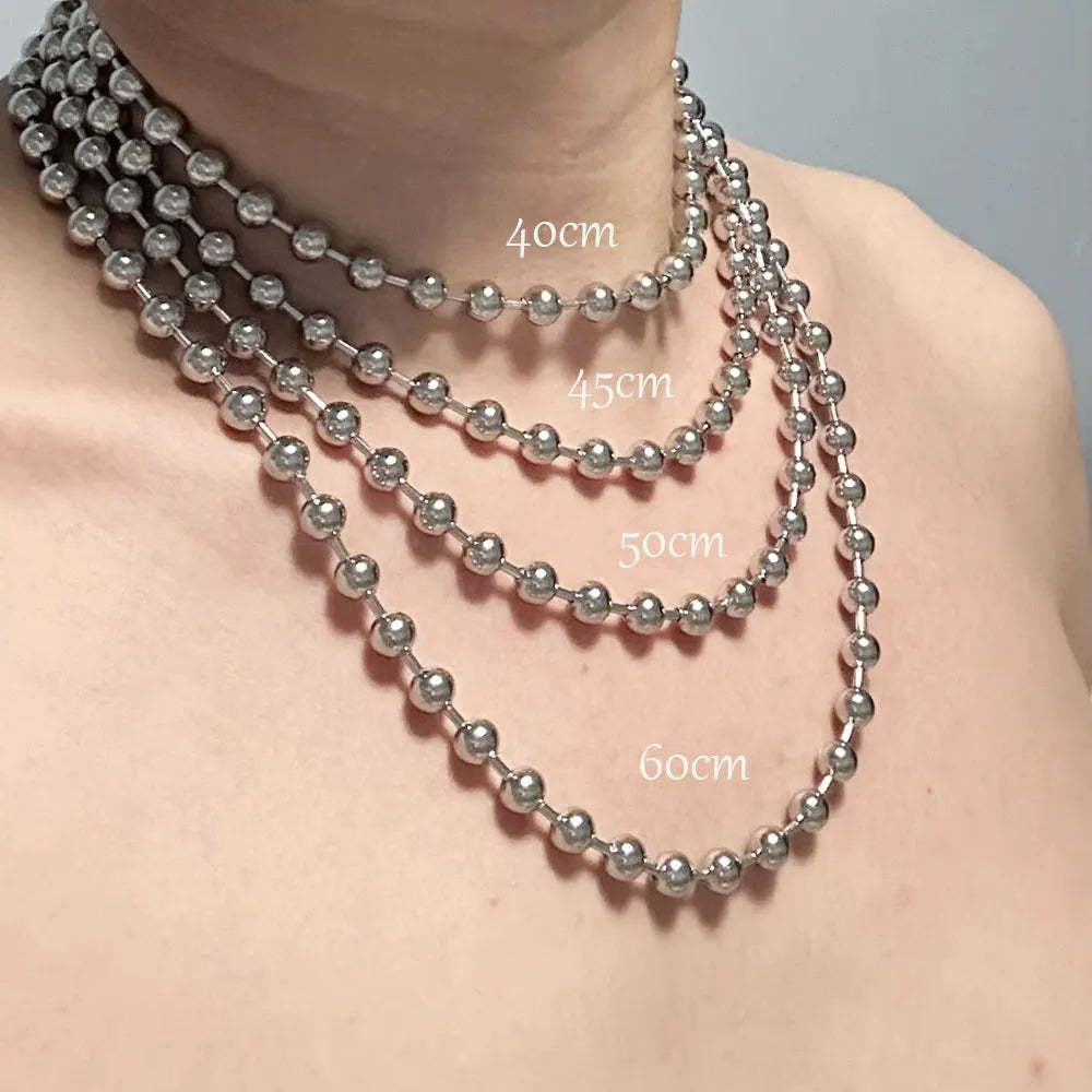 Silver beaded necklace displayed on a mannequin neck with measurements indicated.