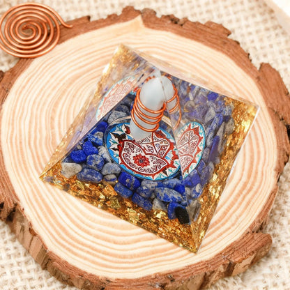 Decorative stone with intricate design on a wooden surface