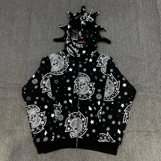 Black hoodie with white patterns on a gray background