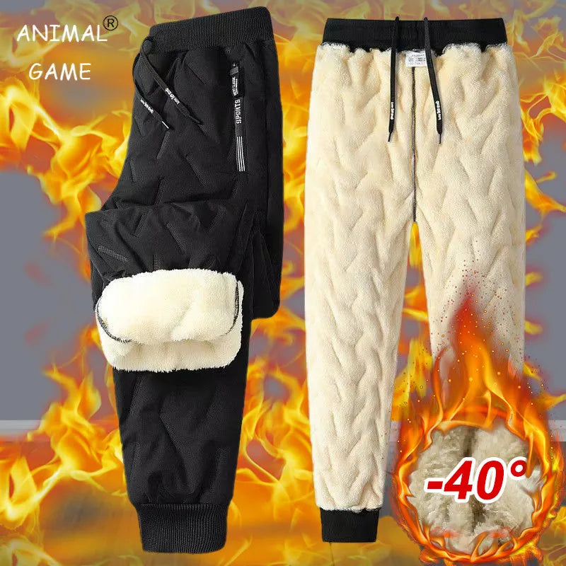 Black and beige winter pants with flame design and temperature indicator on a gray background