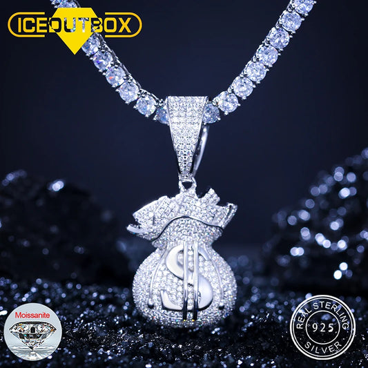 Silver dollar bag pendant necklace with diamond accents on a dark background, featuring ICEOUTBOX branding.
