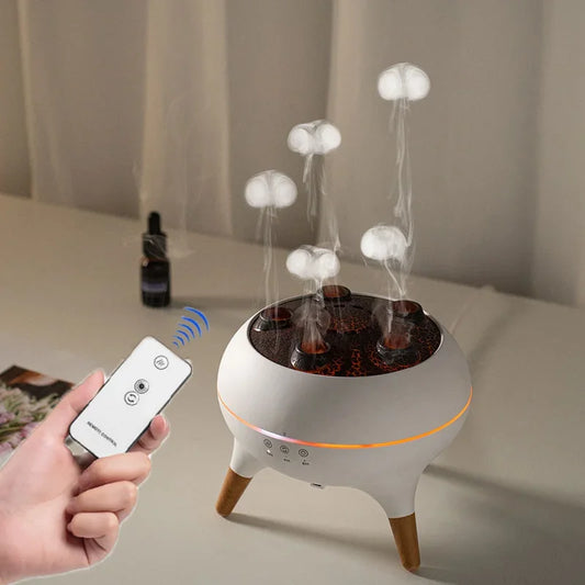 White electronic device with mushroom-shaped lights on a table, held by a hand with a remote control.