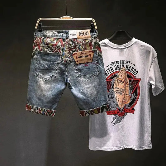 Denim shorts with patterned waistband and graphic t-shirt on a dark background