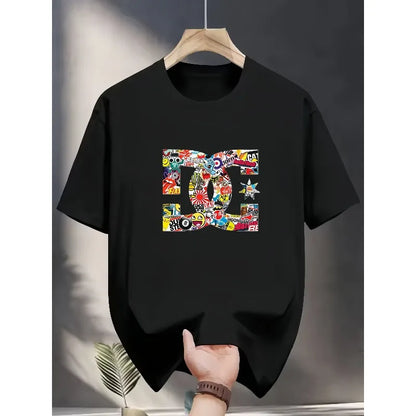 Black t-shirt with colorful graphic design on a hanger against a neutral background
