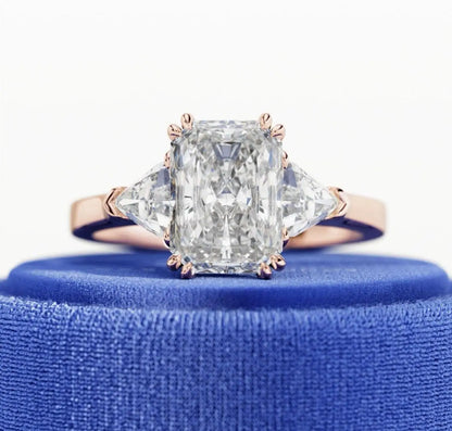 Diamond ring with a blue cushion on a white background