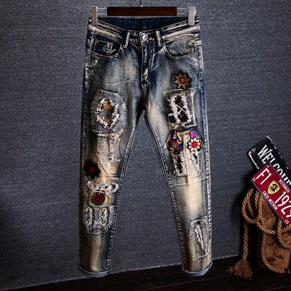 Decorative jeans with embellishments on a gray background