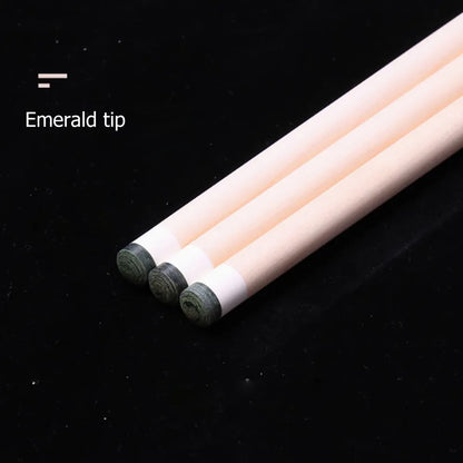 Three pencils with emerald tips on a black background
