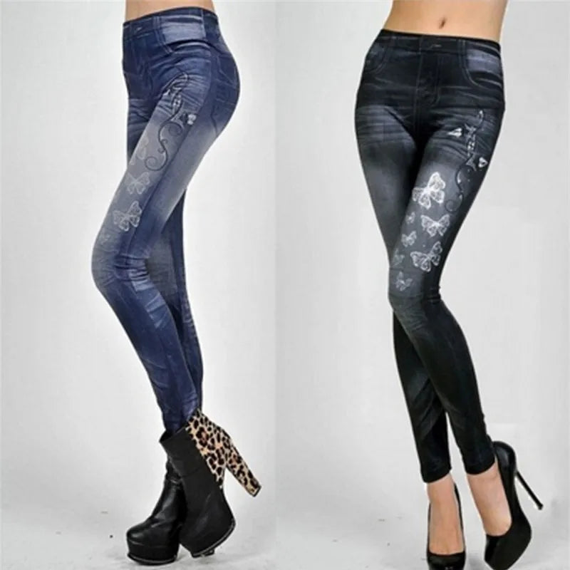 Pair of blue and black floral patterned leggings worn by a person on a white background.
