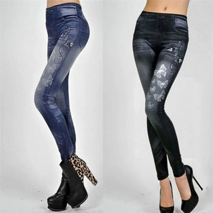 Pair of blue and black floral patterned leggings worn by a person on a white background.