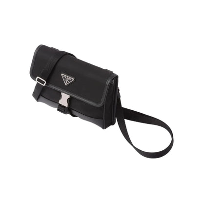 Black Prada handbag with a strap on a white background