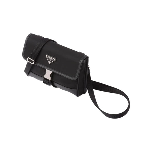 Black Prada handbag with a strap on a white background