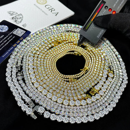 Gold and silver chain with diamond measurement tool on a black background