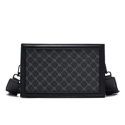 Black patterned crossbody bag on a white background