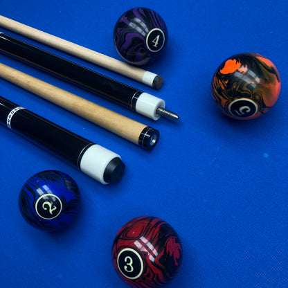 Pool cues and balls on a blue felt surface