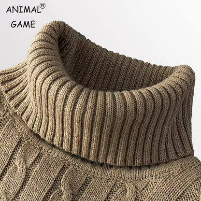 Close-up of a brown knitted sweater with a high collar on a light gray background.