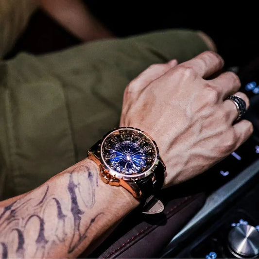 Close-up of a person's wrist wearing a luxurious watch with a dark background