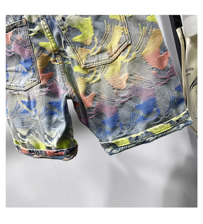 Colorful floral-patterned denim jacket on a white background
