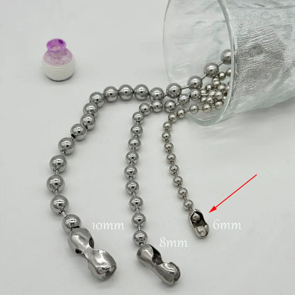 Metallic beaded chain with measurements on a white background