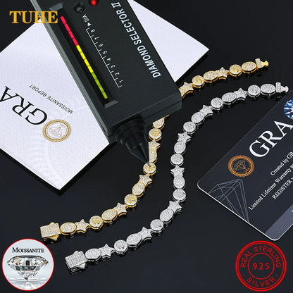 Gold and silver chain with diamond selector and GRA card on a black background