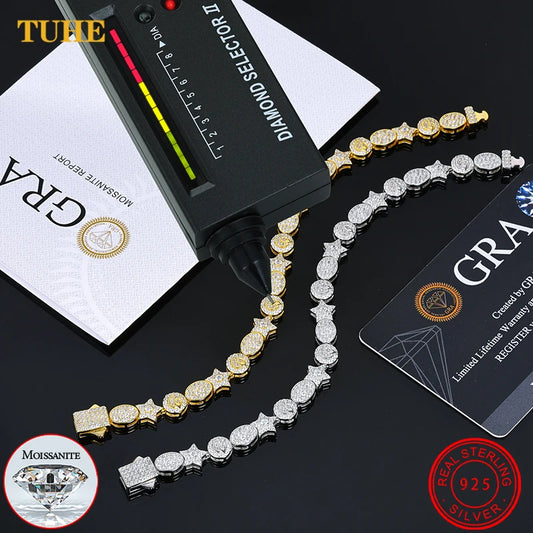 Gold and silver chain with diamond selector and GRA card on a black background