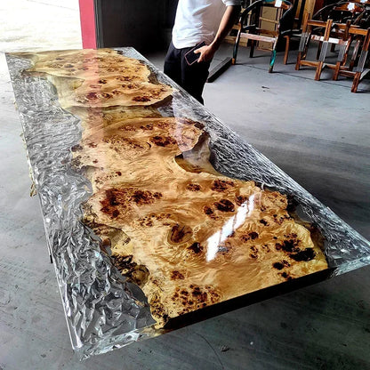 Long wooden table with a glass-like finish in an indoor setting