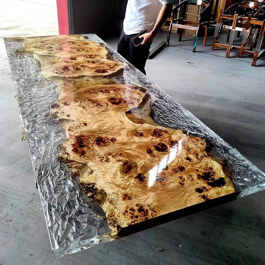 Long wooden table with a glass-like finish in an indoor setting
