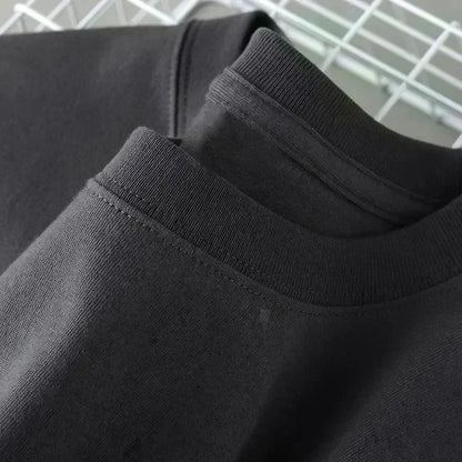 Close-up of black sweatpants with a white background