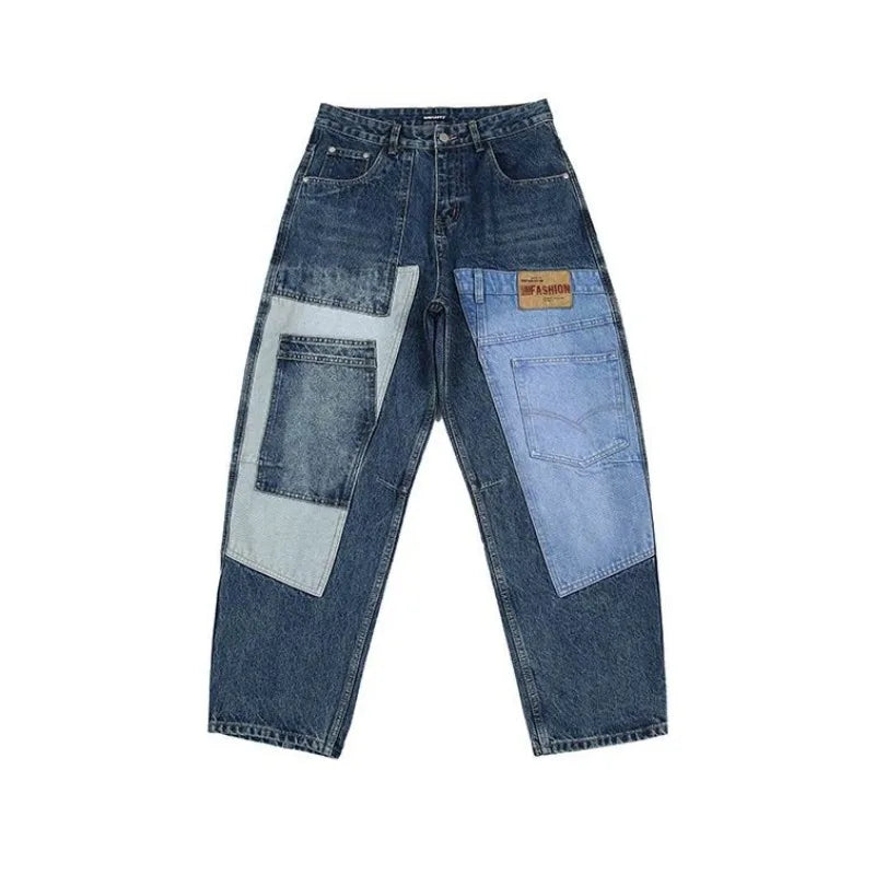Pair of blue jeans with patchwork design on a white background