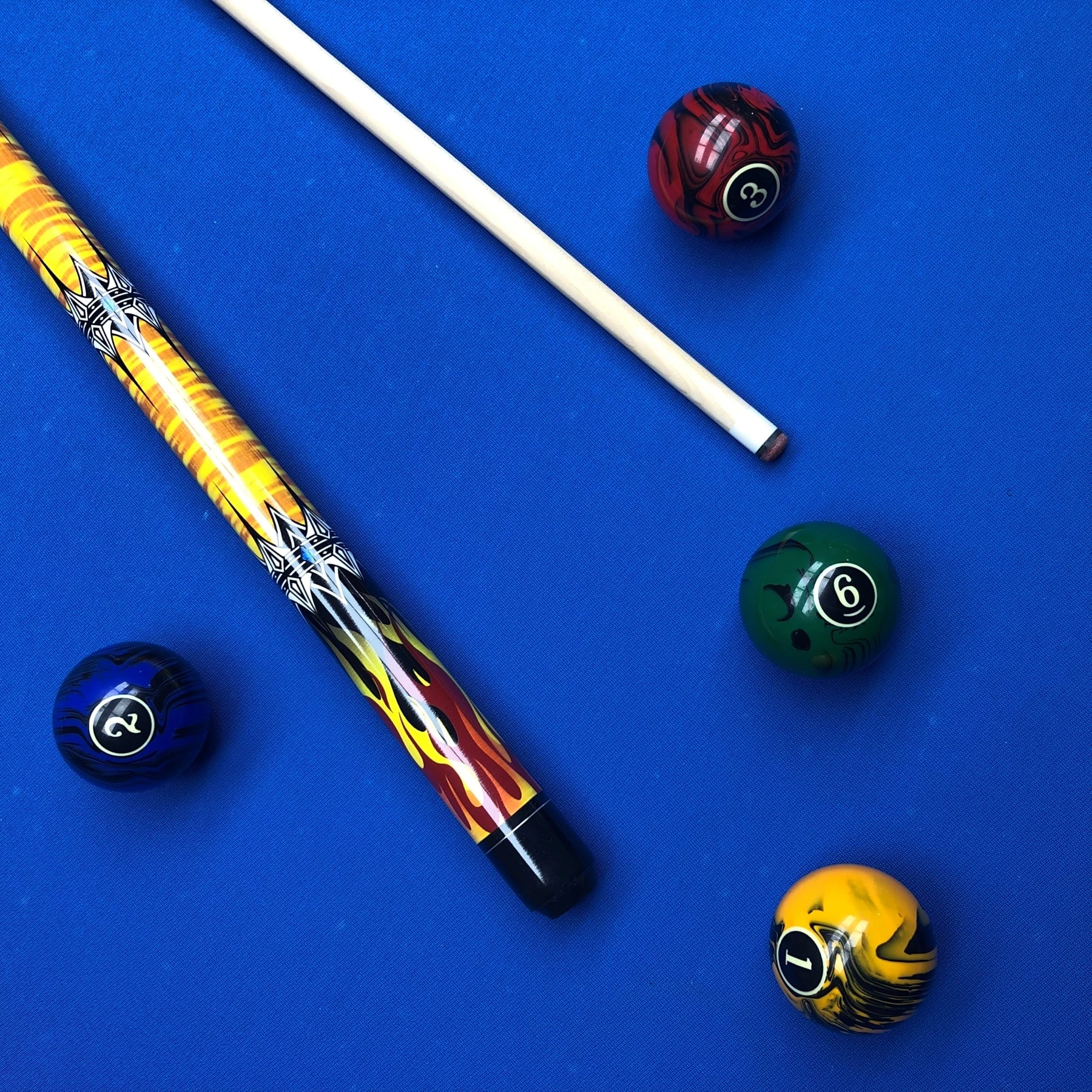 Pool cue and balls on a blue background