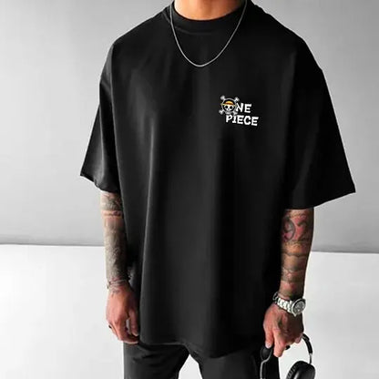 Person wearing a black t-shirt with 'One Piece' logo on a gray background