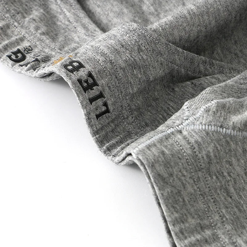 Close-up of gray fabric with 'LIEB' branding on a white background