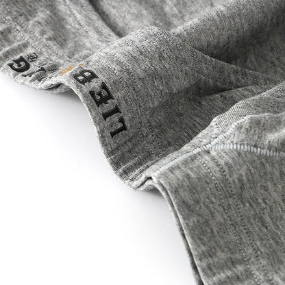 Close-up of gray fabric with 'LIEB' branding on a white background