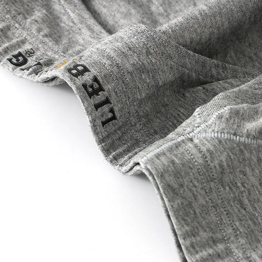 Close-up of gray fabric with 'LIEB' branding on a white background