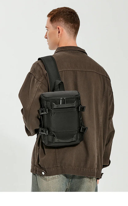 Person wearing a black backpack on a plain background