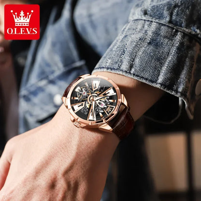 Person wearing a rose gold watch with a blurred background
