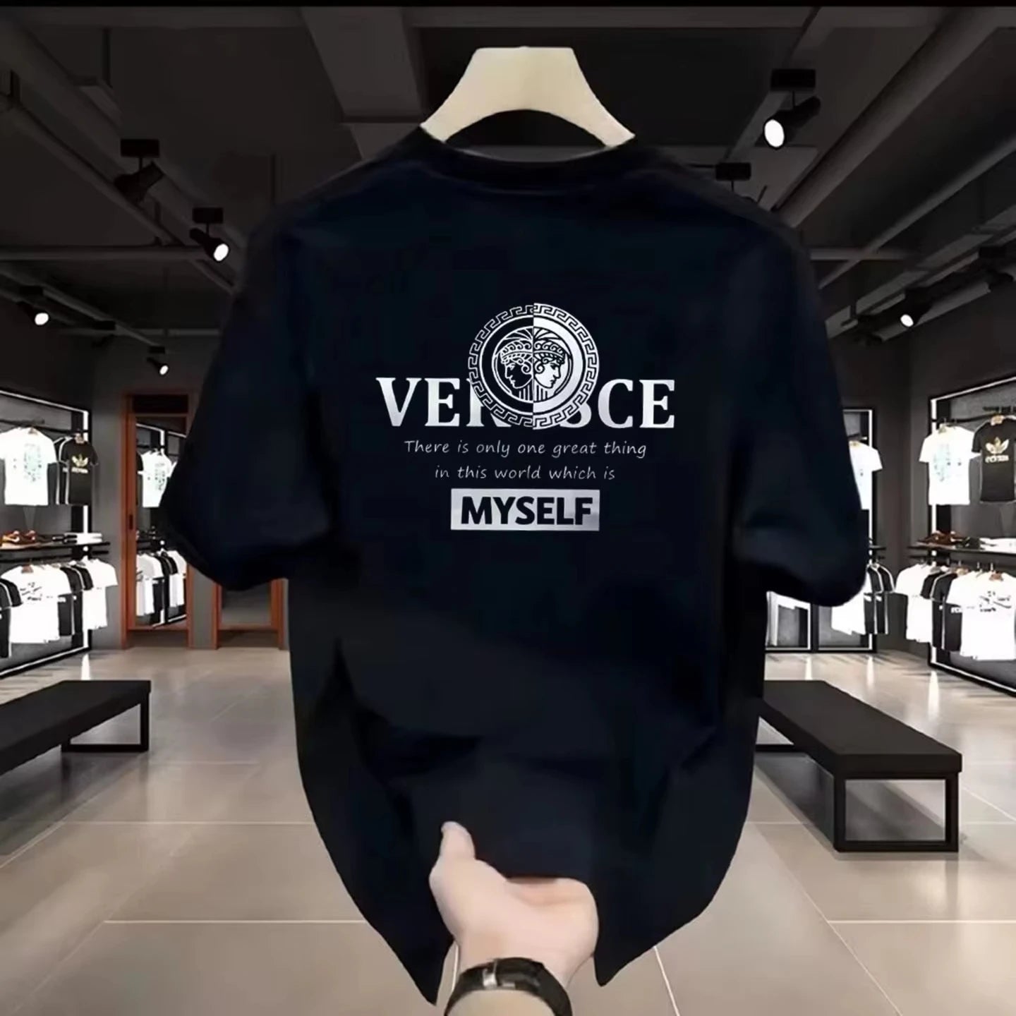Black t-shirt with 'VERSE' logo and text in a store setting