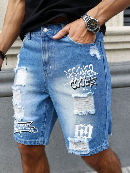 Person wearing distressed denim shorts with text design, standing on steps.