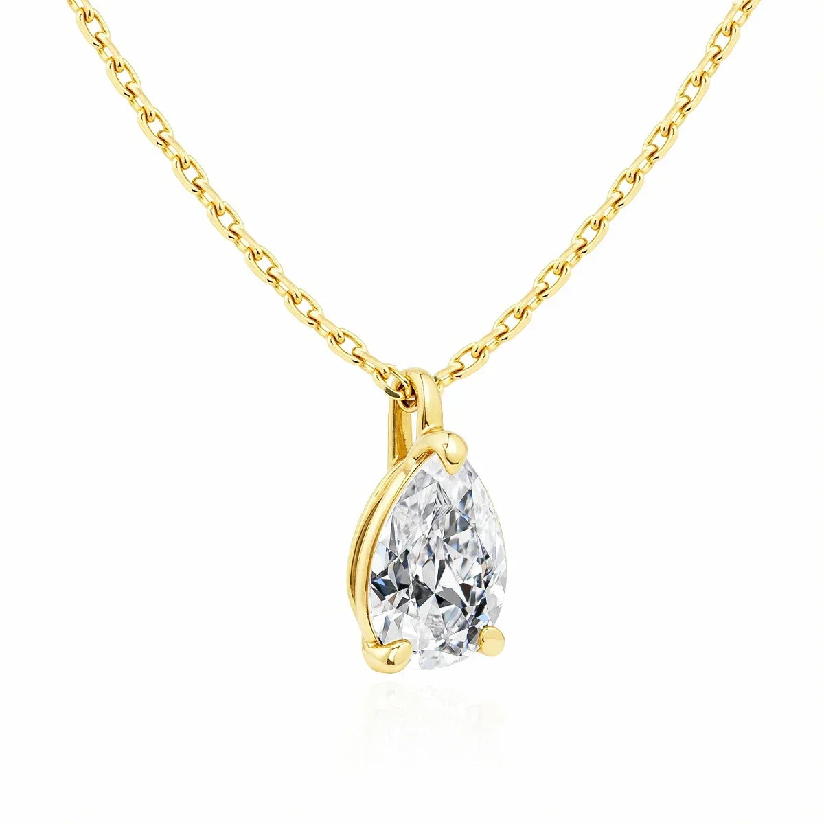 Gold necklace with a pear-shaped diamond pendant on a white background