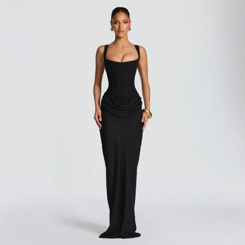 Woman wearing a black evening gown on a light gray background