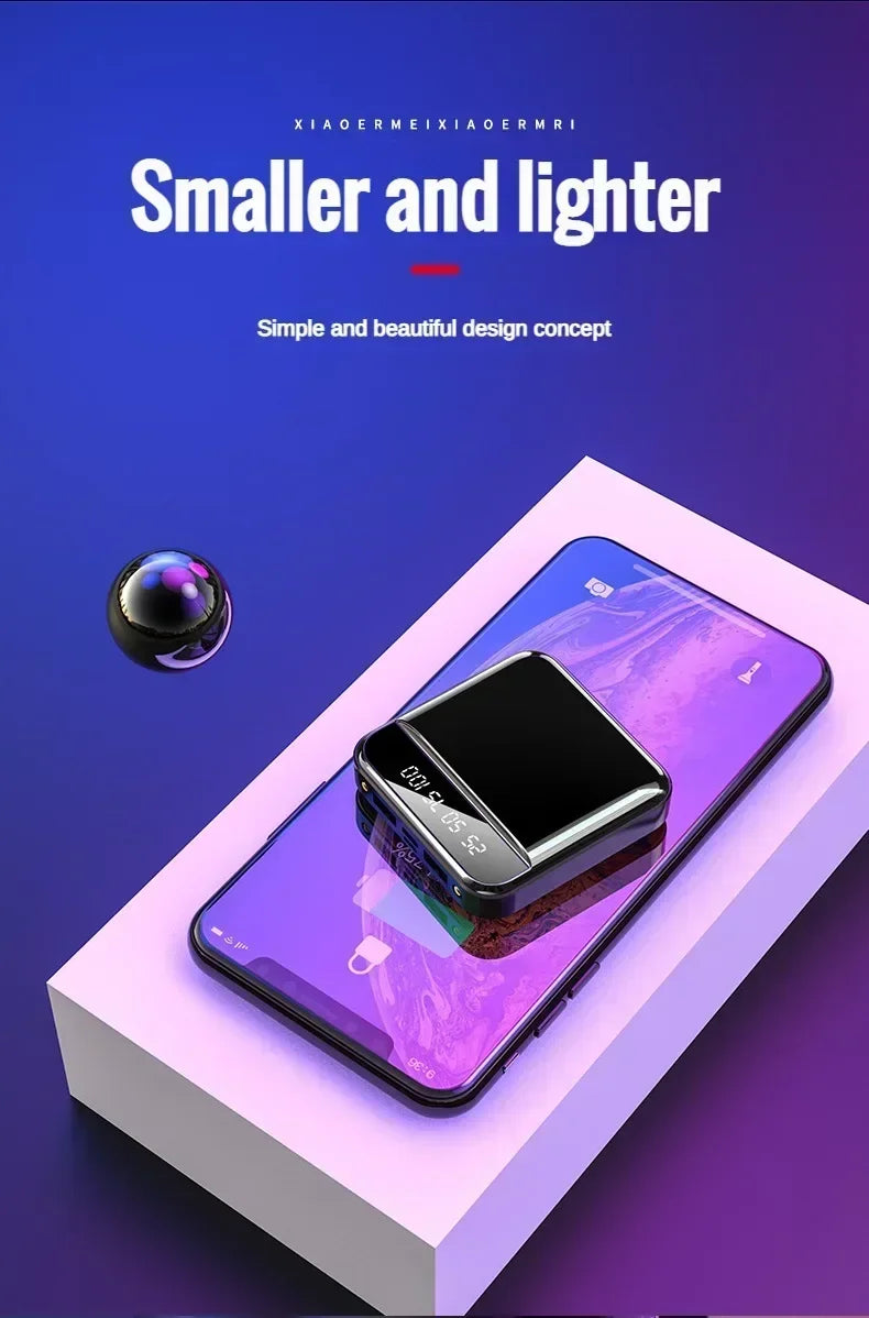 Smartphone with a small black device on a purple and white background