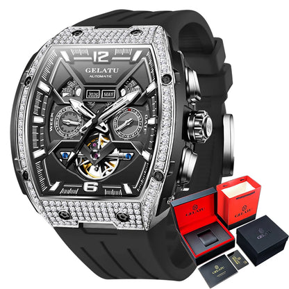 Luxury watch with intricate design and black strap, displayed with packaging on a white background.