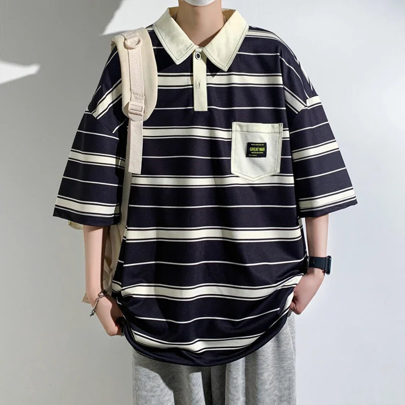 Person wearing a navy and white striped shirt with a beige backpack on a plain background
