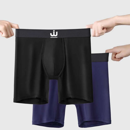 Black and blue boxer briefs held up against a light gray background