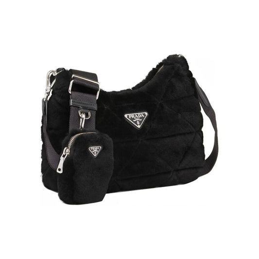 Black Prada handbag with matching pouch on a white background