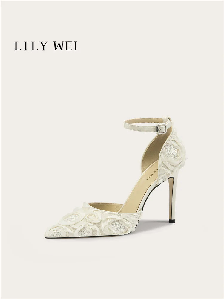 White lace high-heeled shoe with 'LILY WEI' branding on a white background