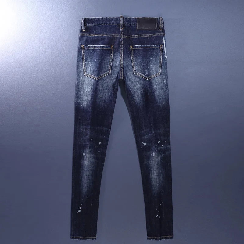 Blue distressed jeans on a gray background