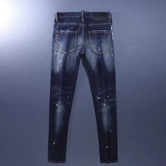Blue distressed jeans on a gray background